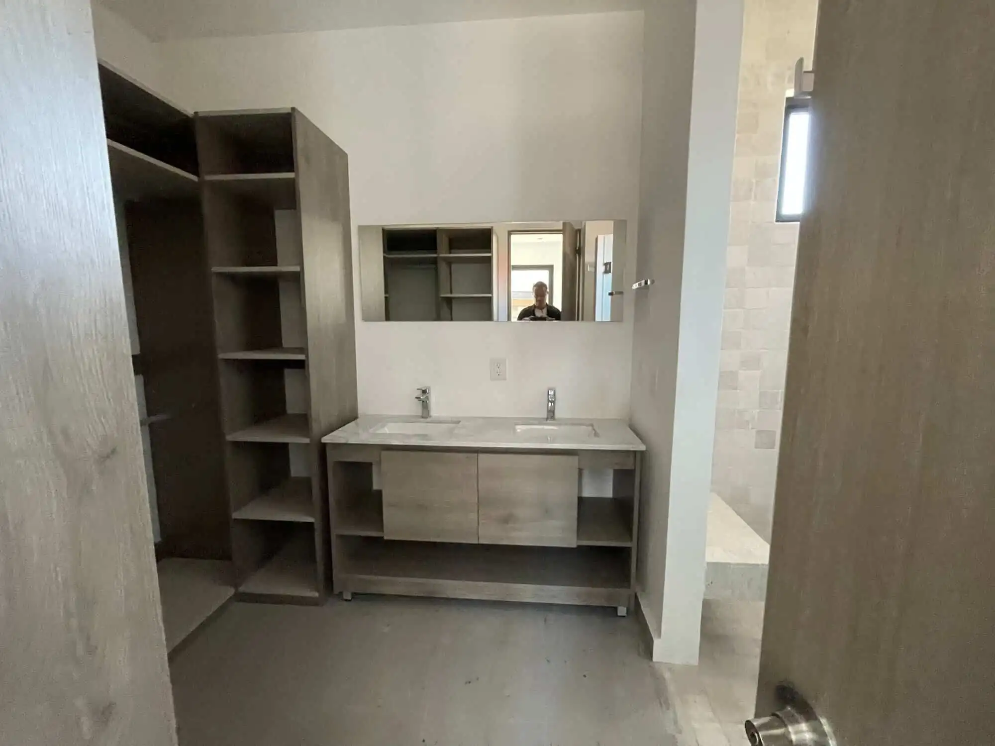 Penthouse Bathroom with Modern Fixtures Modern bathroom in penthouse condo with dual sinks and stylish cabinetry.