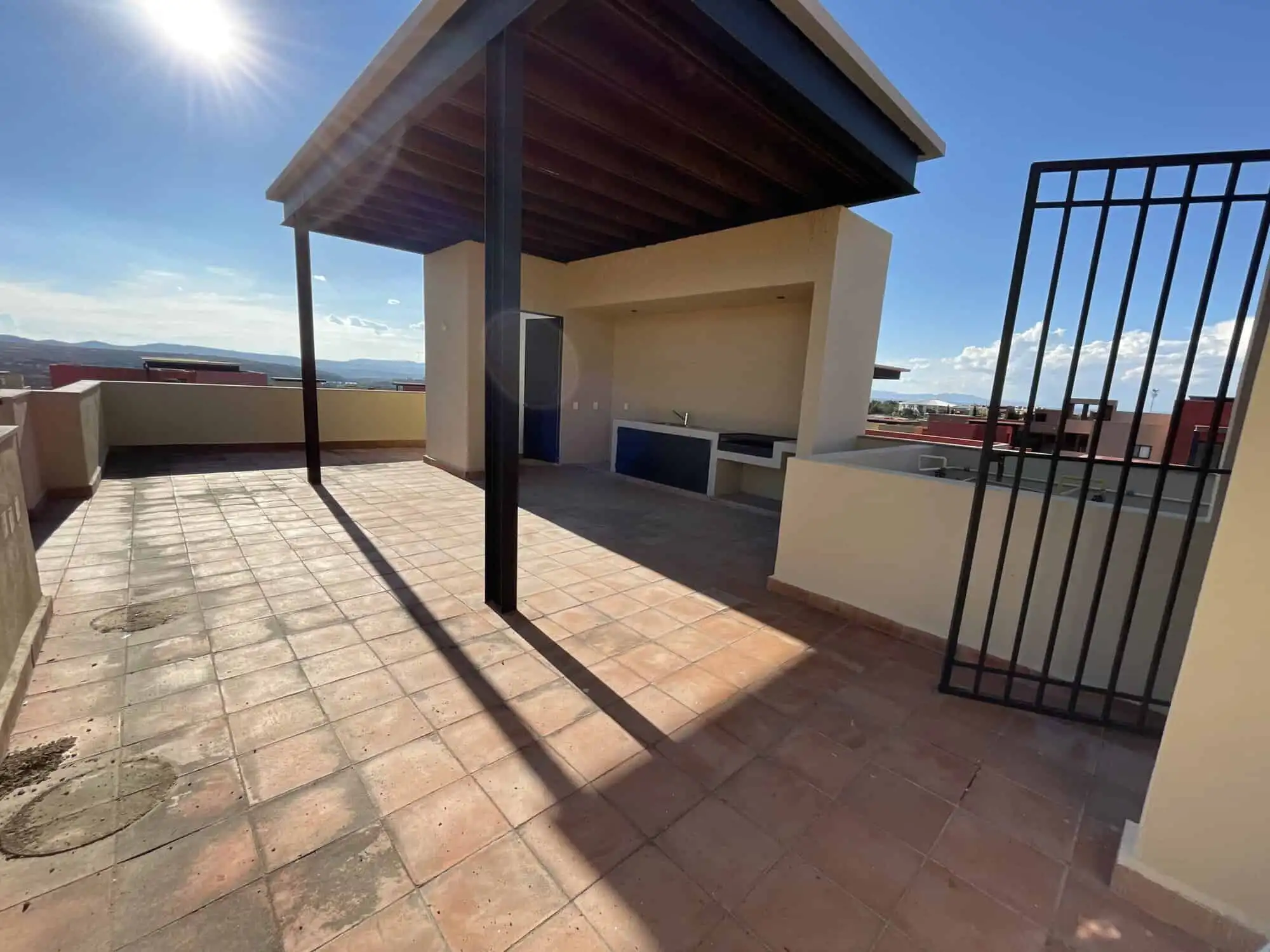 Penthouse Rooftop Terrace in San Miguel de Allende Rooftop terrace of a penthouse condo with shaded area and city views in San Miguel de Allende.
