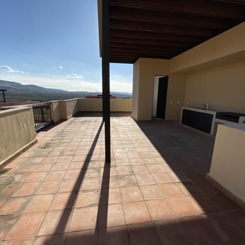 Spacious penthouse condo featuring a private rooftop terrace with scenic views of San Miguel de Alle.