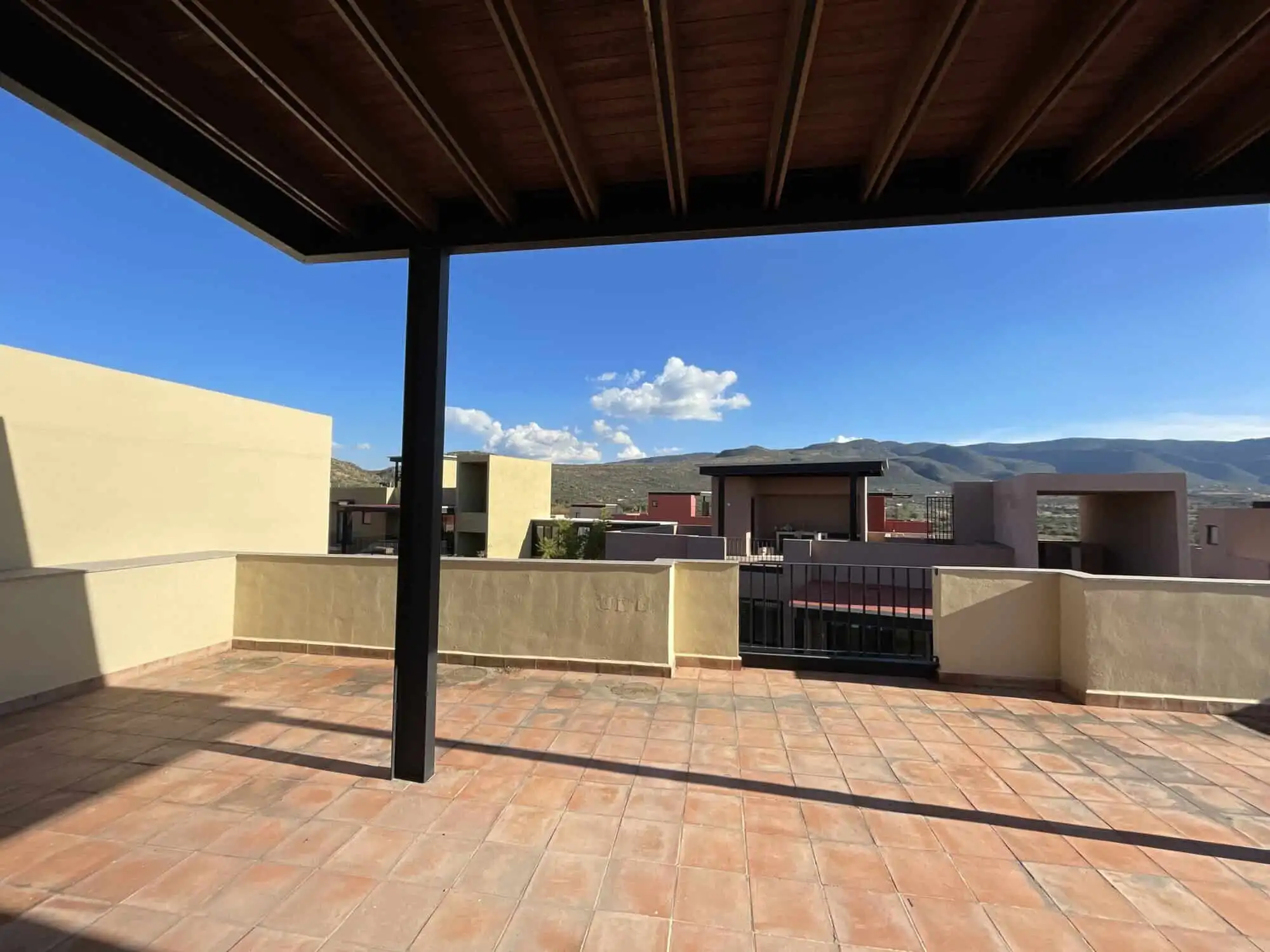 Penthouse Condo Rooftop View Stunning rooftop terrace of a penthouse condo in San Miguel de Allende with panoramic mountain views.