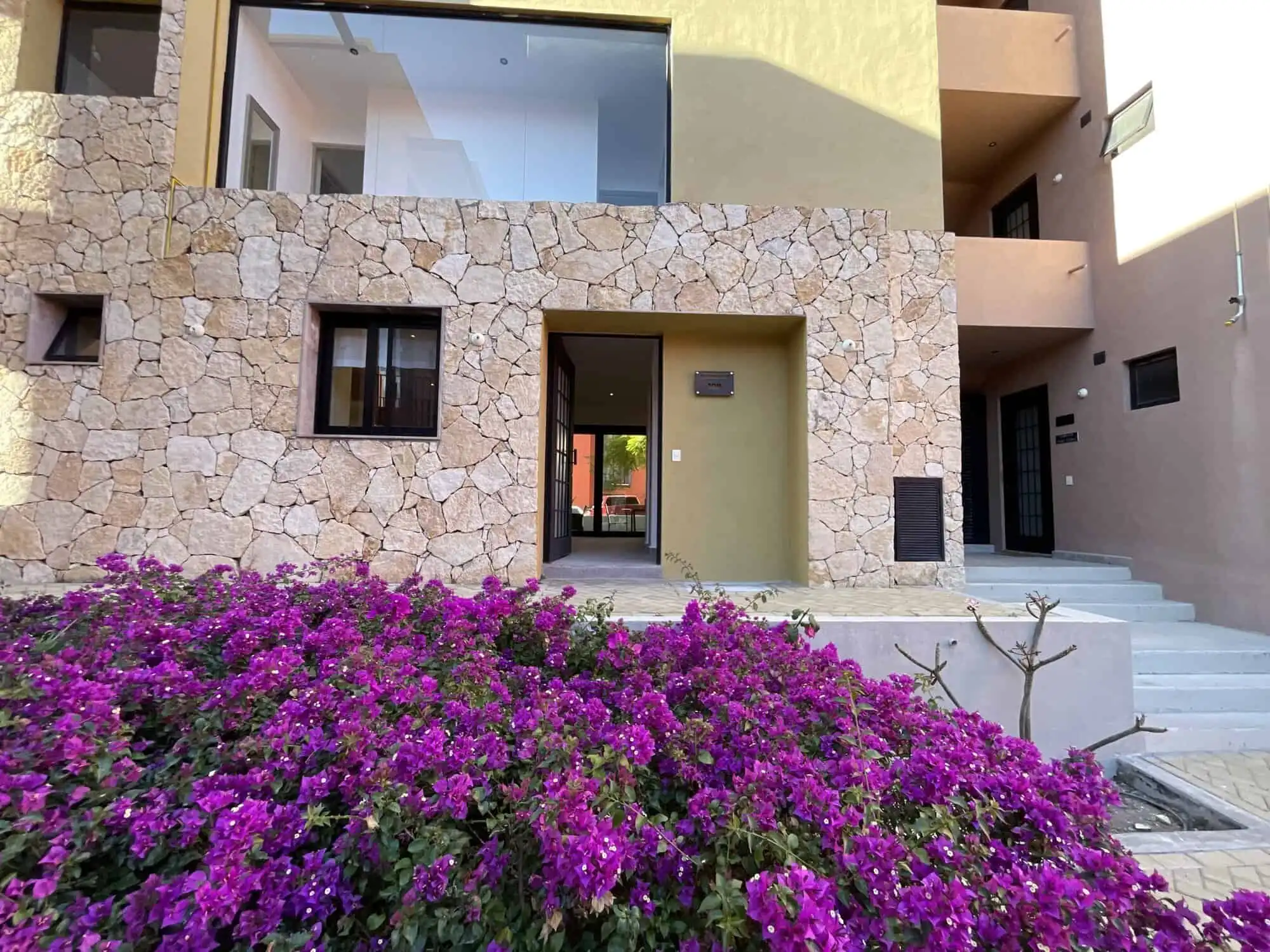 Modern Stone Facade Home in San Miguel de Allende Modern stone exterior home with large glass windows in San Miguel de Allende.