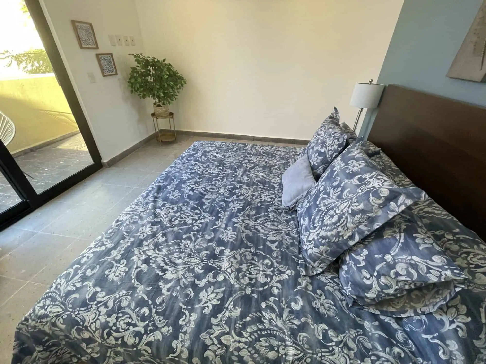 Luxury 3-Bedroom Home in Punta del Cielo Spacious bedroom with elegant blue and white bedding, modern decor, and natural light in Punta del C.