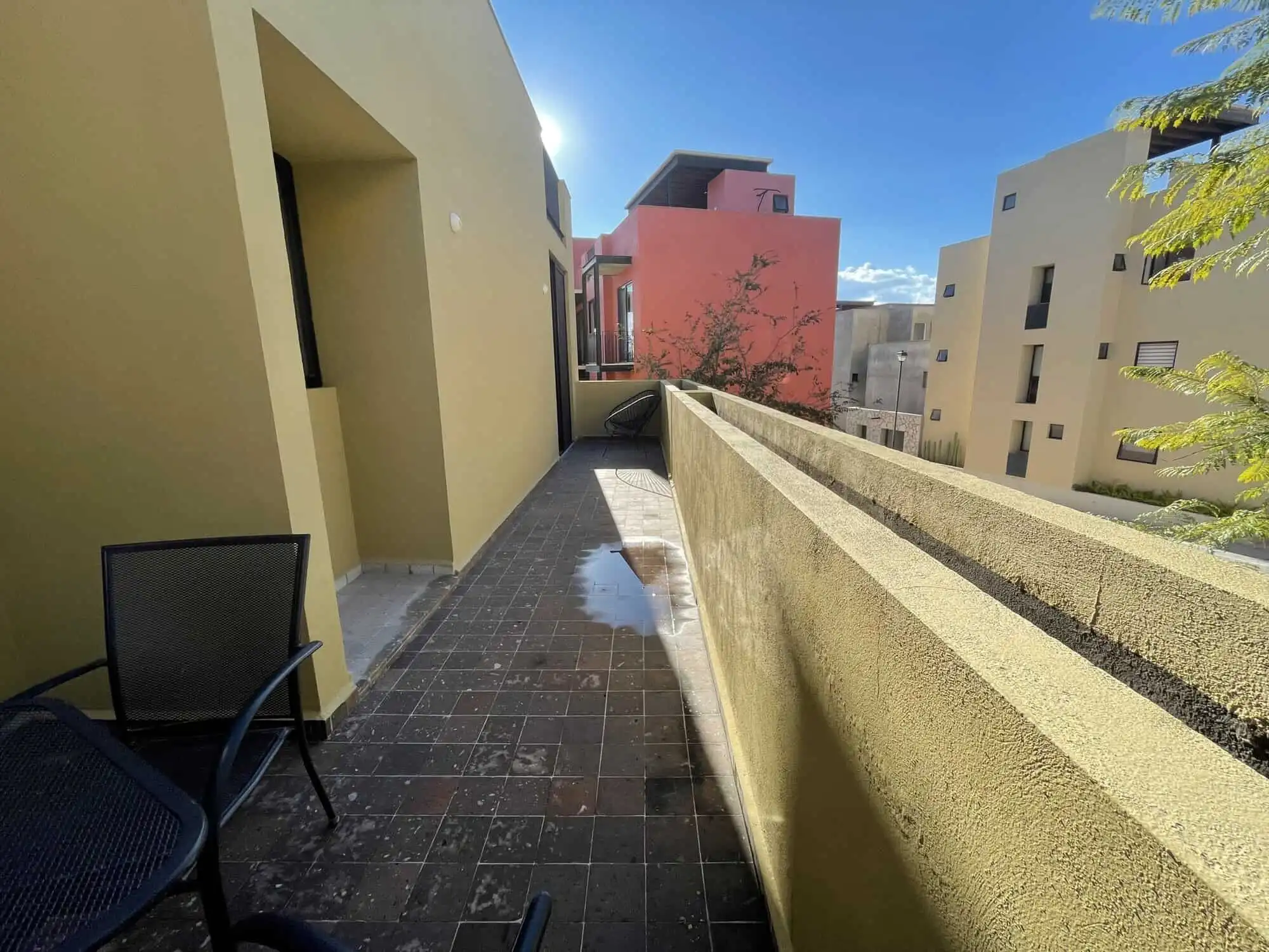 Luxury 3-Bedroom Home in Punta del Cielo Spacious balcony of a modern Punta del Cielo home with city views and outdoor seating.