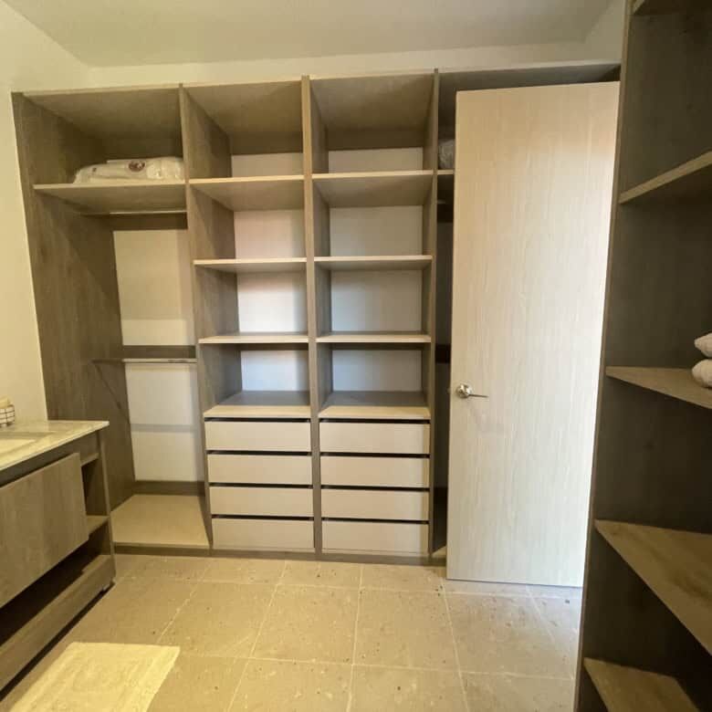 Spacious walk-in closet with ample storage in Punta del Cielo home.