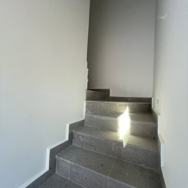 Interior staircase of a modern penthouse in Punta del Cielo, San Miguel de Allende.