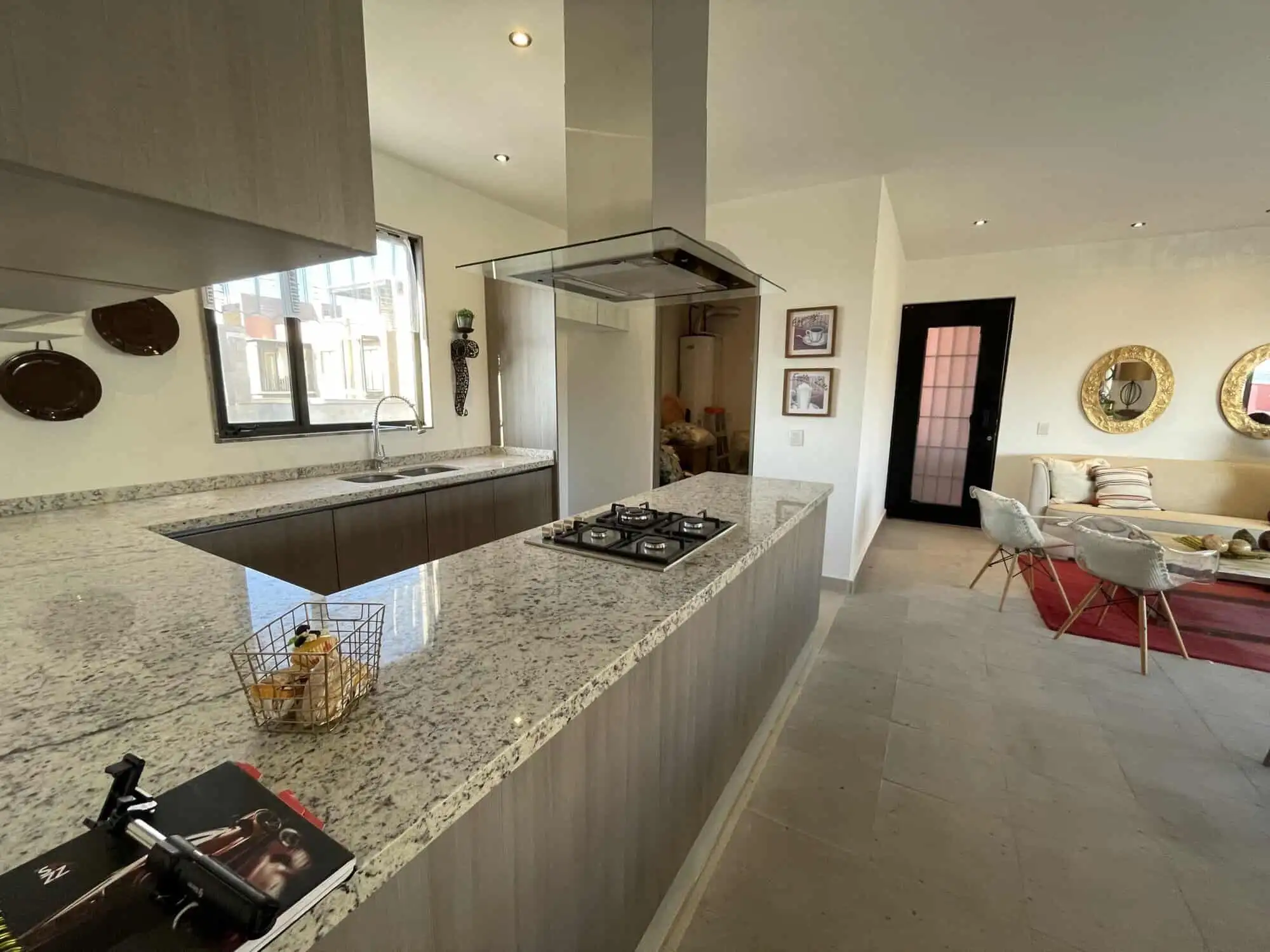 Spacious kitchen with modern appliances and open-plan living area in Punta del Cielo.