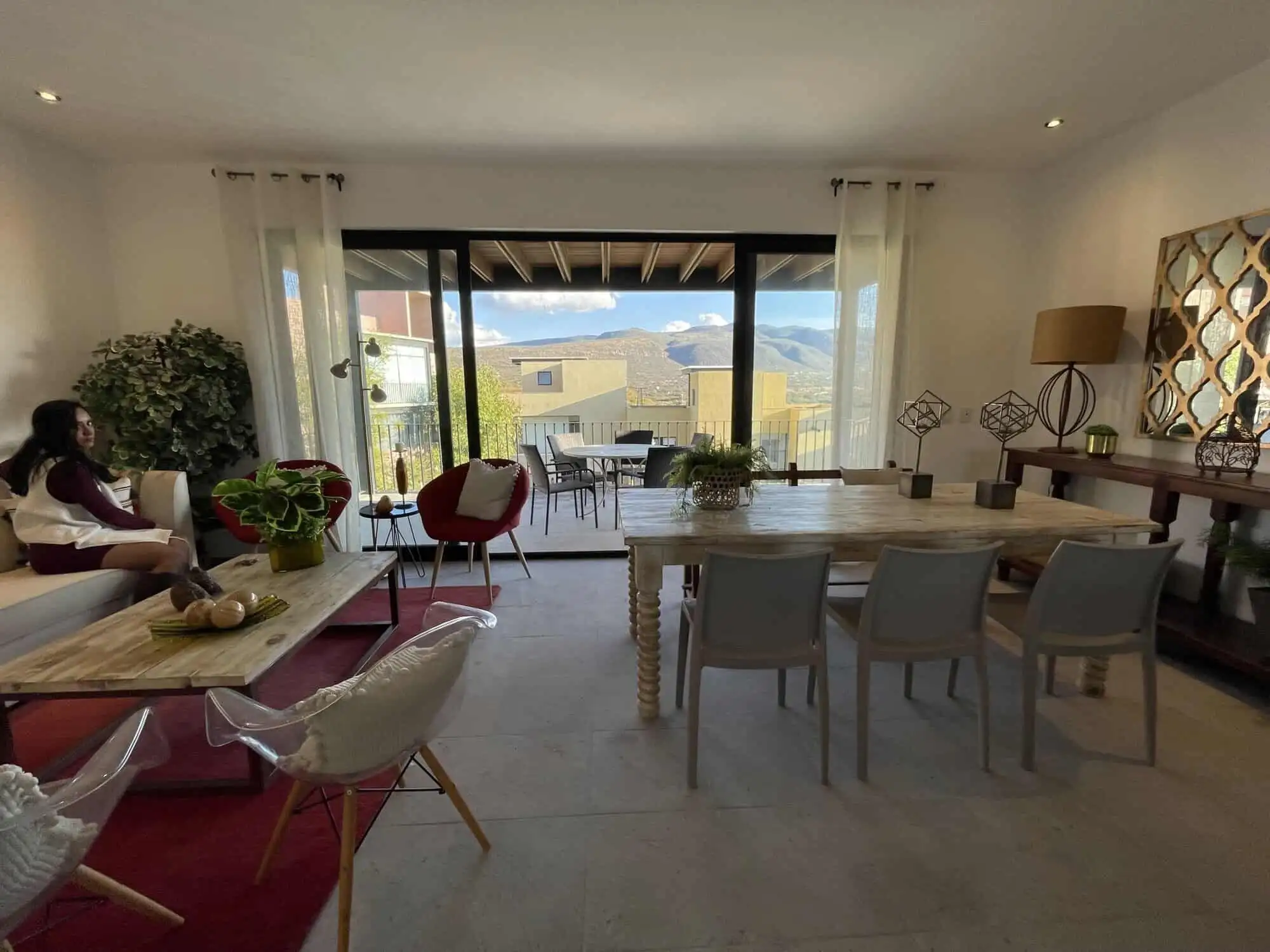Elegant living room with large windows and scenic views in Punta del Cielo penthouse.