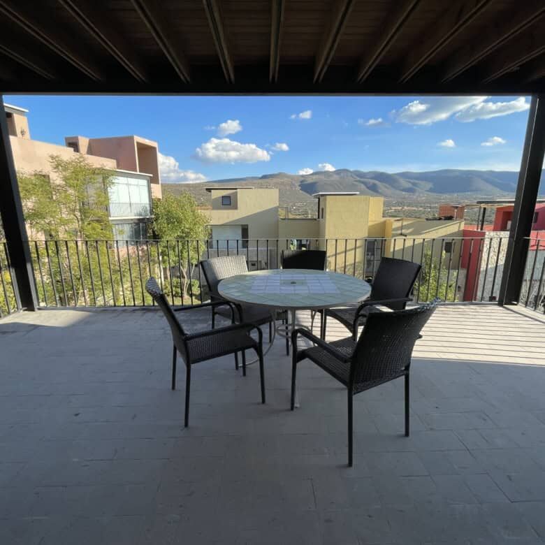 Spacious terrace of a luxury 2-bedroom penthouse with mountain views in San Miguel de Allende.