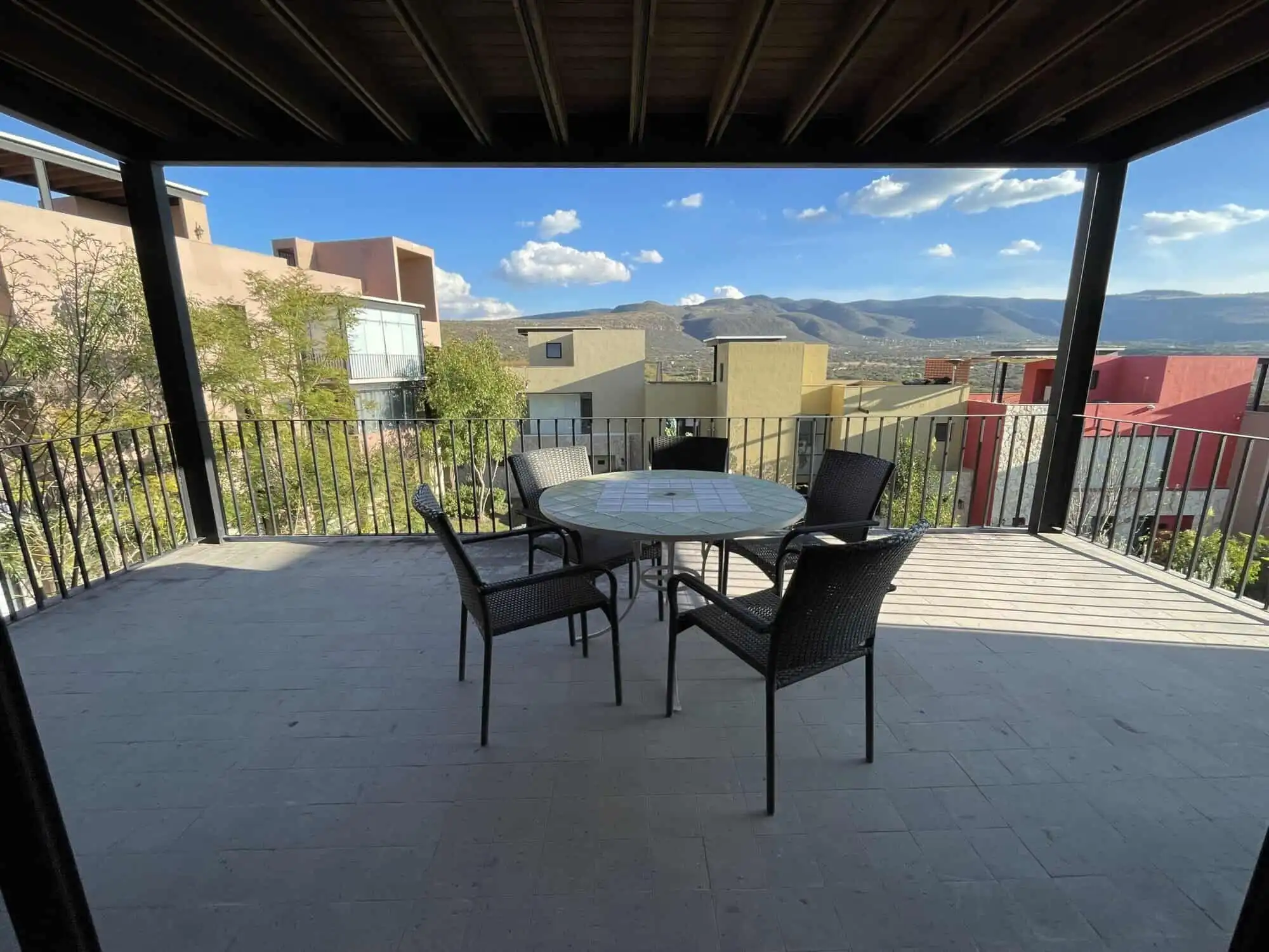 Spacious terrace of a luxury 2-bedroom penthouse with mountain views in San Miguel de Allende.