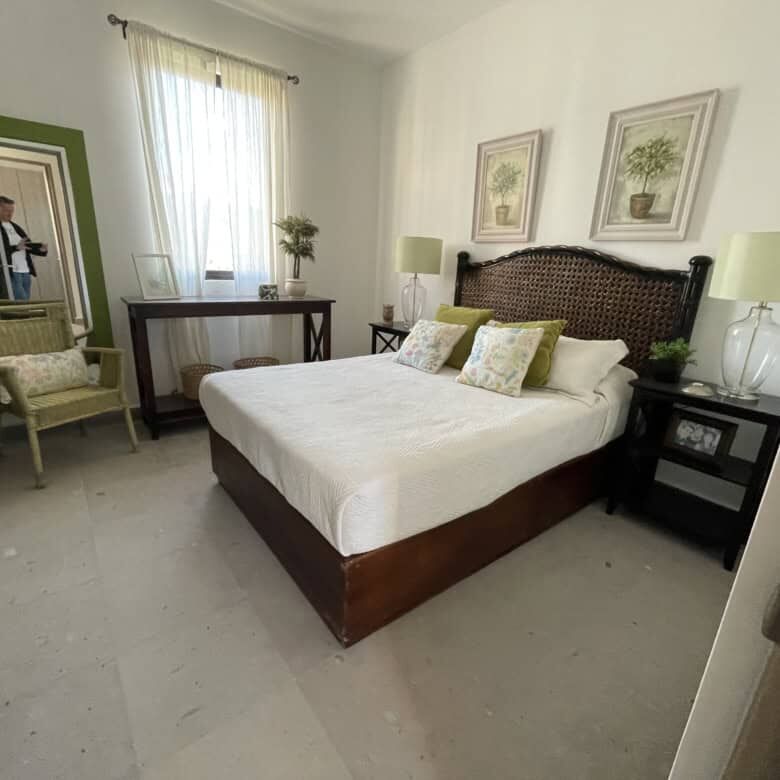 Spacious bedroom with elegant decor, large window, and natural light in Punta del Cielo penthouse.
