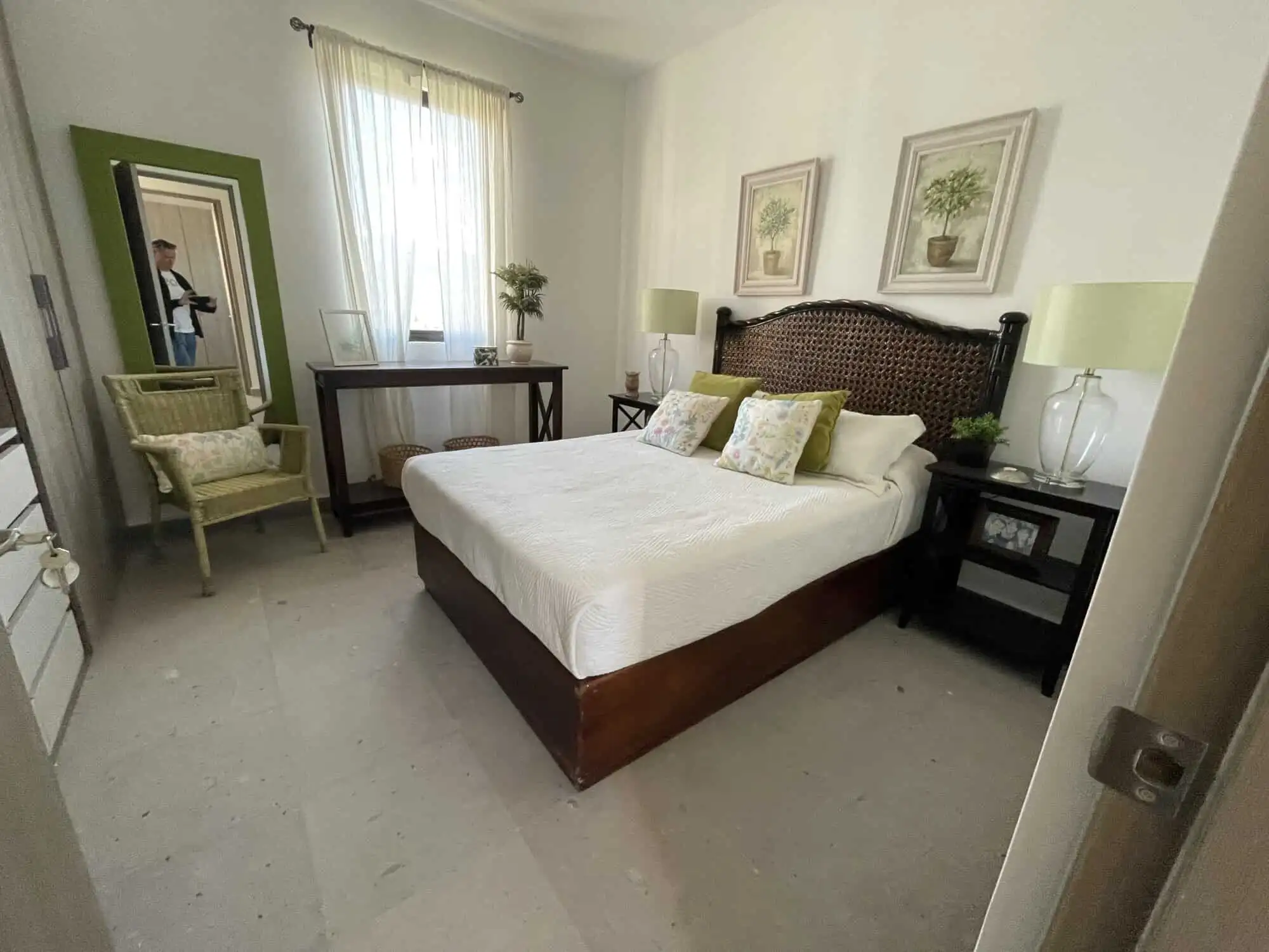 Spacious bedroom with elegant decor, large window, and natural light in Punta del Cielo penthouse.