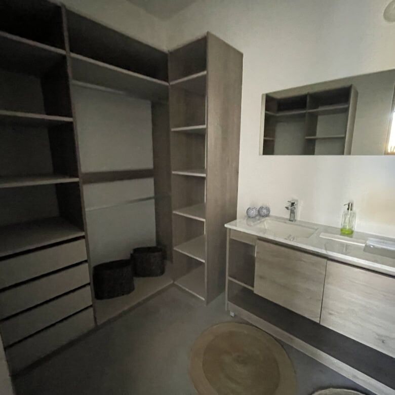 Elegant bathroom with modern fixtures and ample storage space.