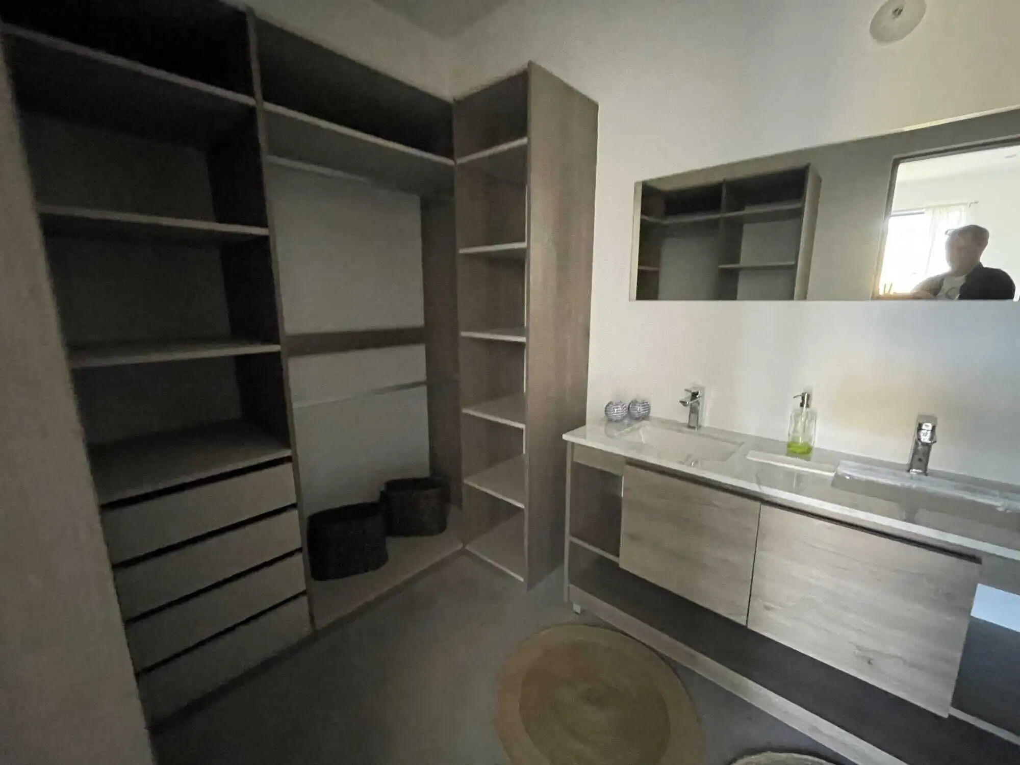 Elegant bathroom with modern fixtures and ample storage space.