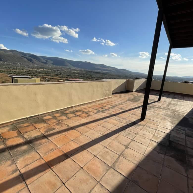 Spacious terrace of a luxury 2-bedroom penthouse with mountain views in Punta del Cielo, San Miguel.