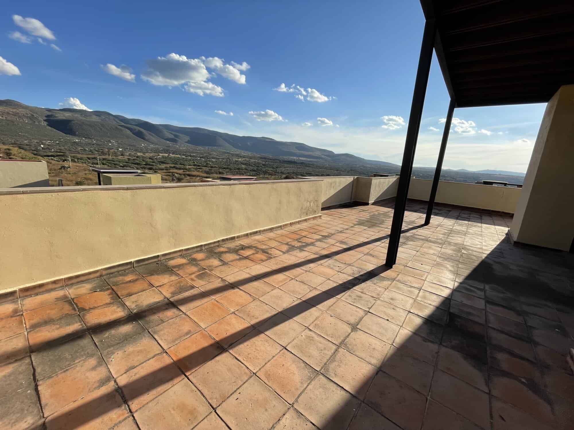 Spacious terrace of a luxury 2-bedroom penthouse with mountain views in Punta del Cielo, San Miguel.