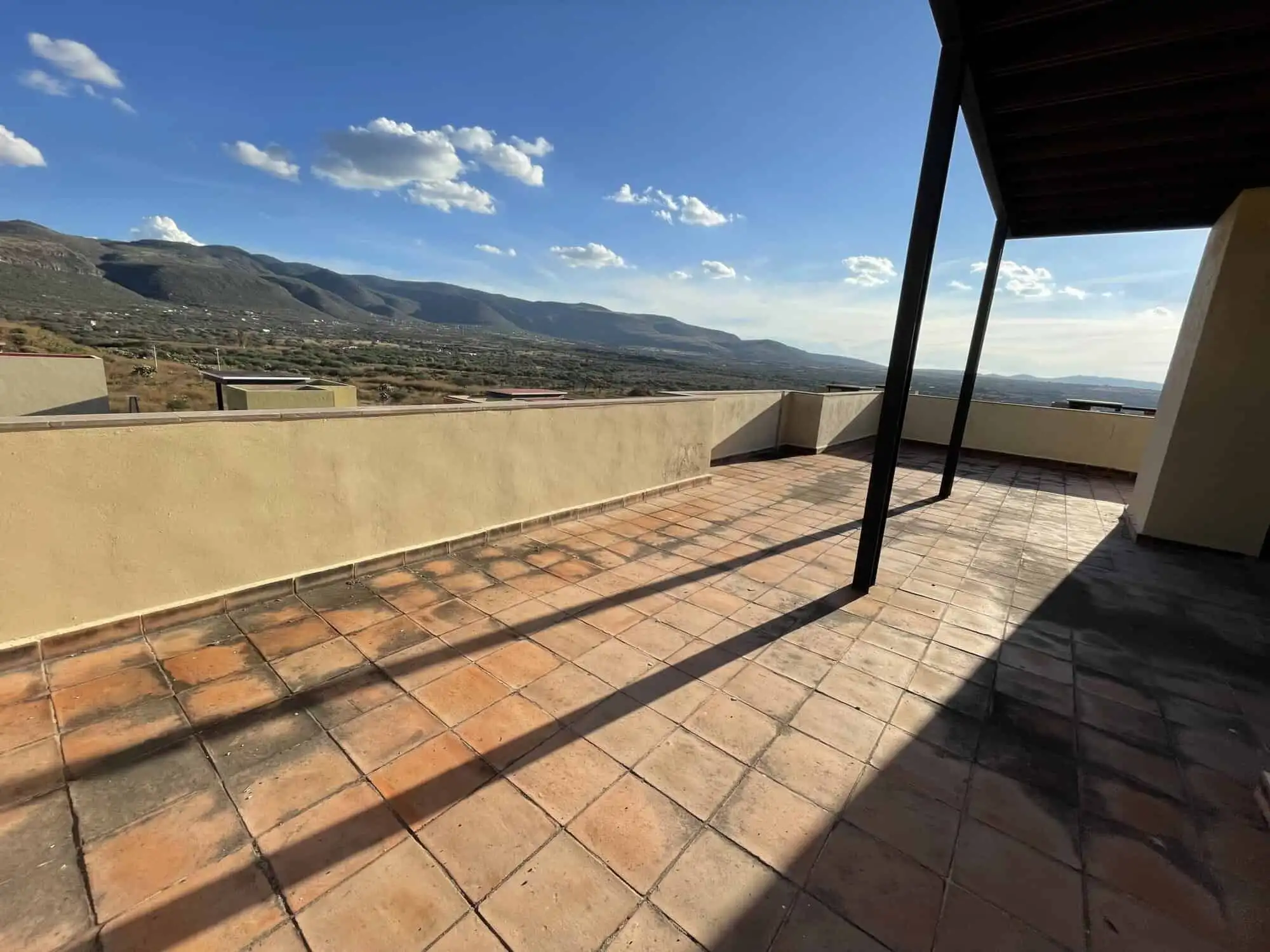 Spacious terrace of a luxury 2-bedroom penthouse with mountain views in Punta del Cielo, San Miguel.
