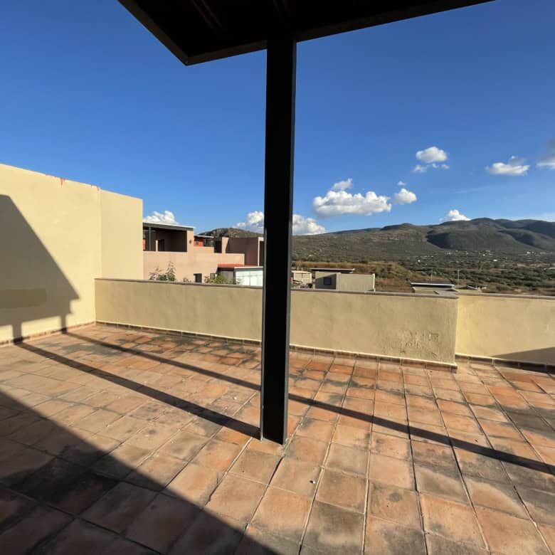 Spacious terrace of a luxury 2-bedroom penthouse in Punta del Cielo, San Miguel de Allende, with sce.