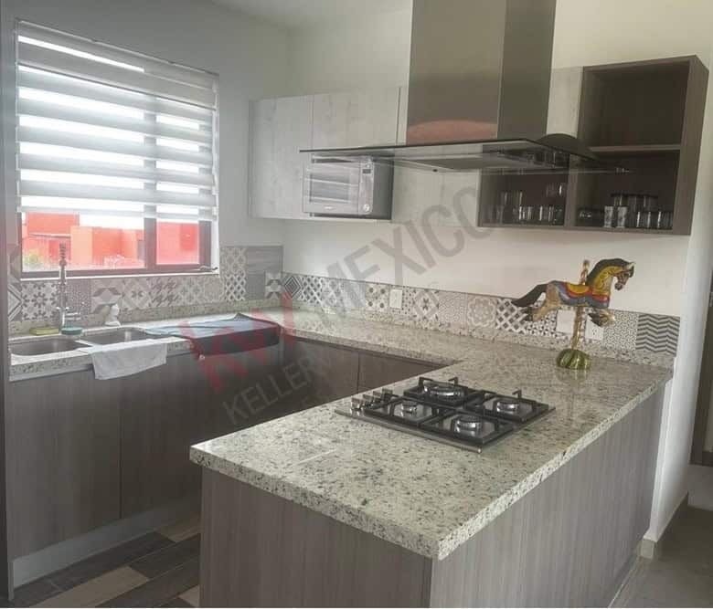 Kitchen with mountain views, granite countertops, and contemporary cabinetry in San Miguel de Allend.