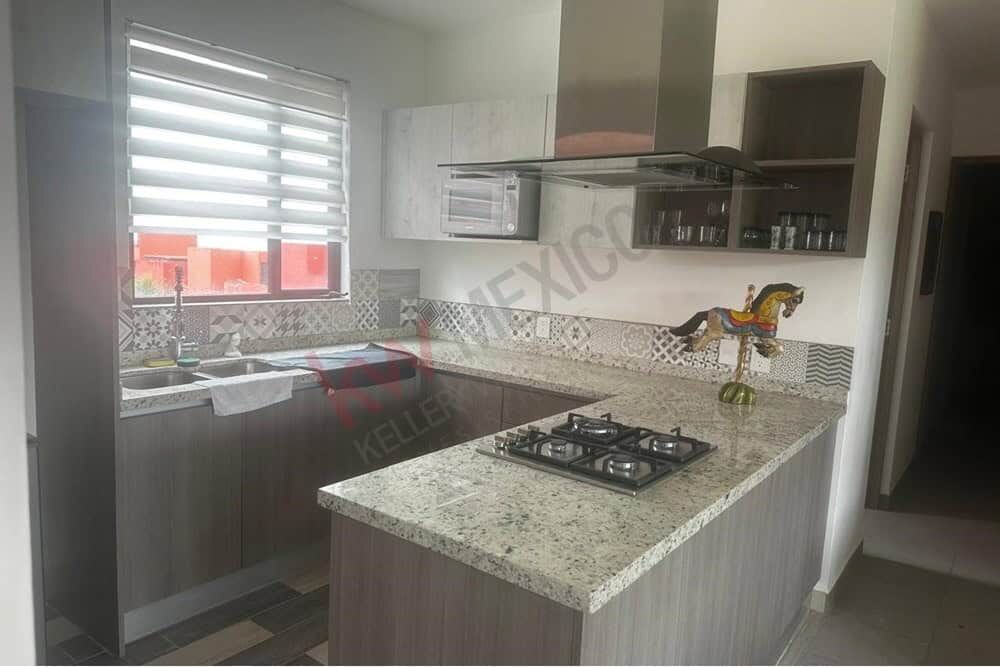 Modern kitchen with mountain views in San Miguel de Allende Kitchen with mountain views, granite countertops, and contemporary cabinetry in San Miguel de Allend.