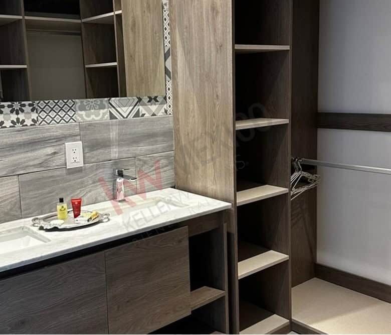 Elegant kitchen with custom wood cabinets and marble countertop in Punta de Cielo.