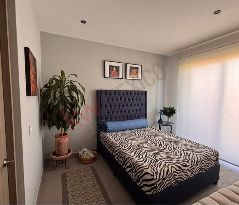 Penthouse bedroom with mountain views in Punta de Cielo, San Miguel de Allende, featuring stylish de.
