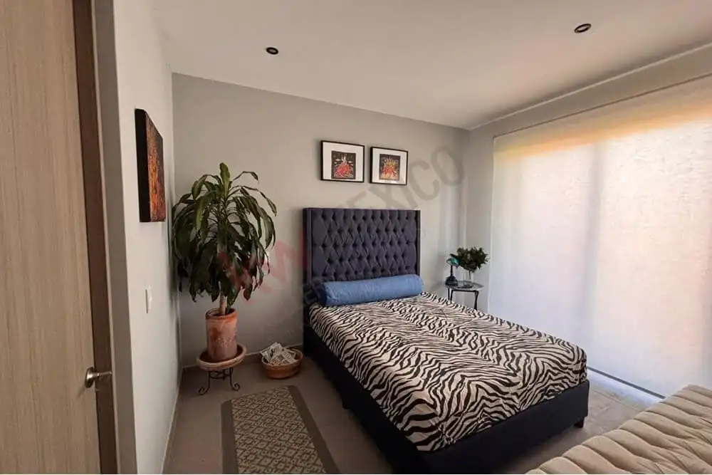 Penthouse bedroom with mountain views in Punta de Cielo, San Miguel de Allende, featuring stylish de.