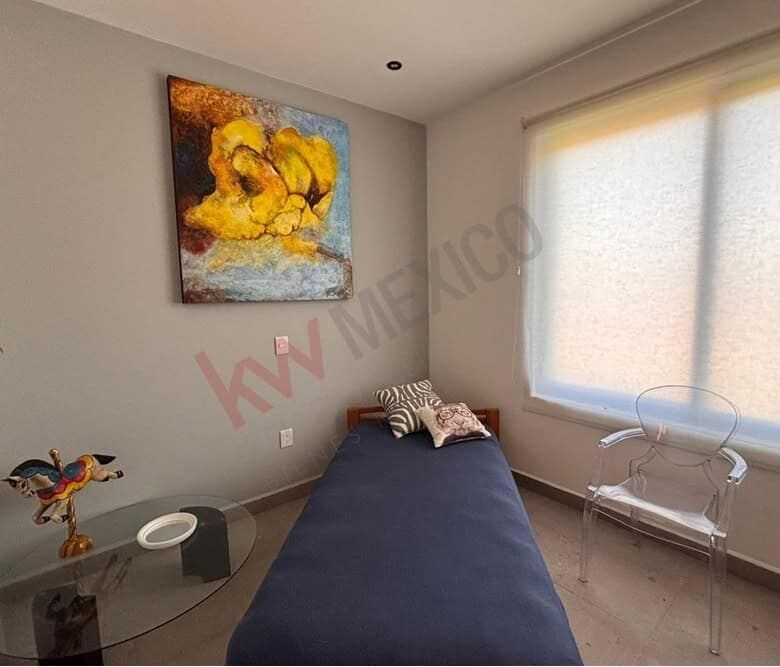 San Miguel de Allende penthouse bedroom with mountain views and contemporary decor.