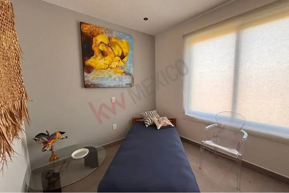 San Miguel de Allende penthouse bedroom with mountain views and contemporary decor.