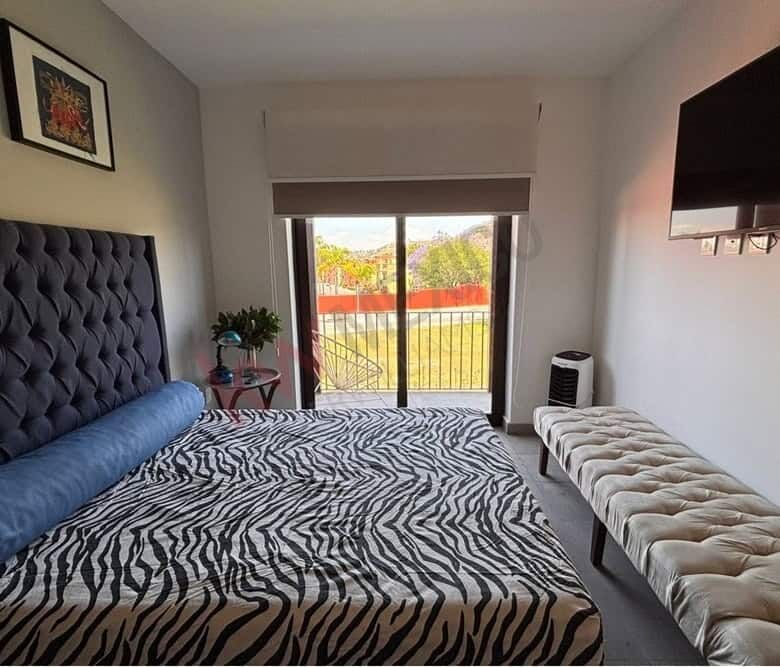 Bright bedroom with mountain views in Punta de Cielo, San Miguel de Allende. Modern decor and spacio.