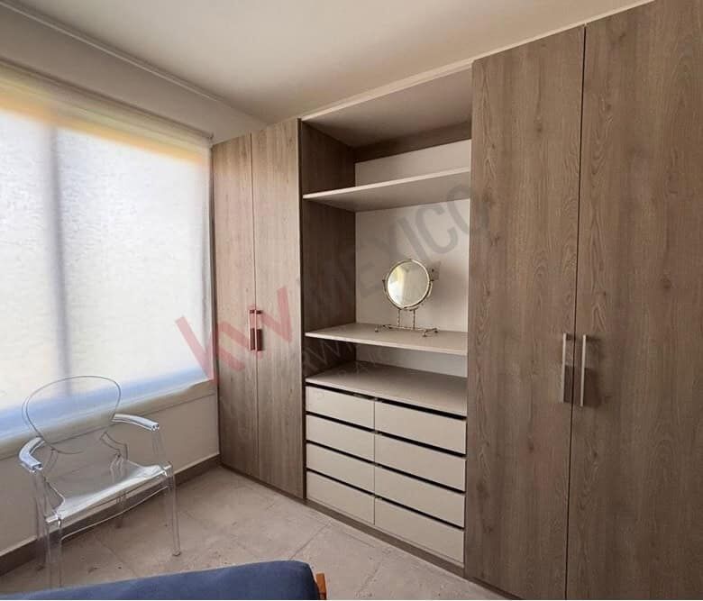 Spacious wardrobe with drawers and open shelves, ideal for organizing belongings.