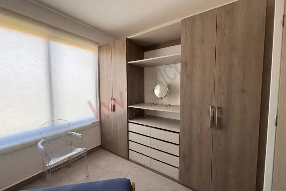 Spacious wardrobe with drawers and open shelves, ideal for organizing belongings.
