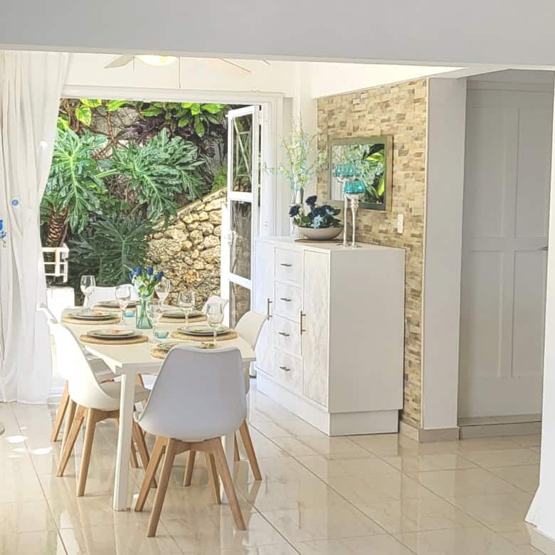 Elegant dining area with garden view in Sosua, Dominican Republic.