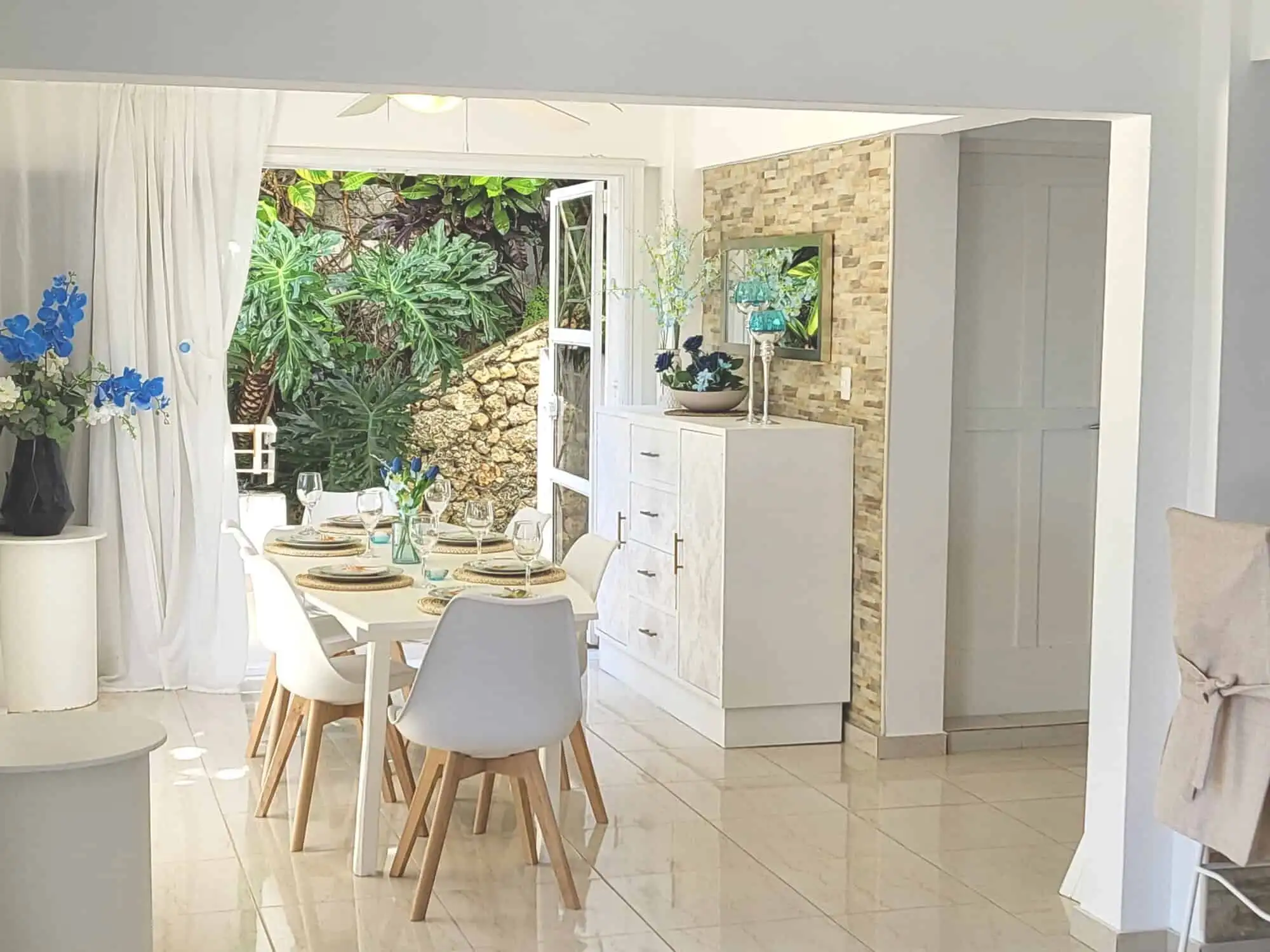 Elegant dining area with garden view in Sosua, Dominican Republic.