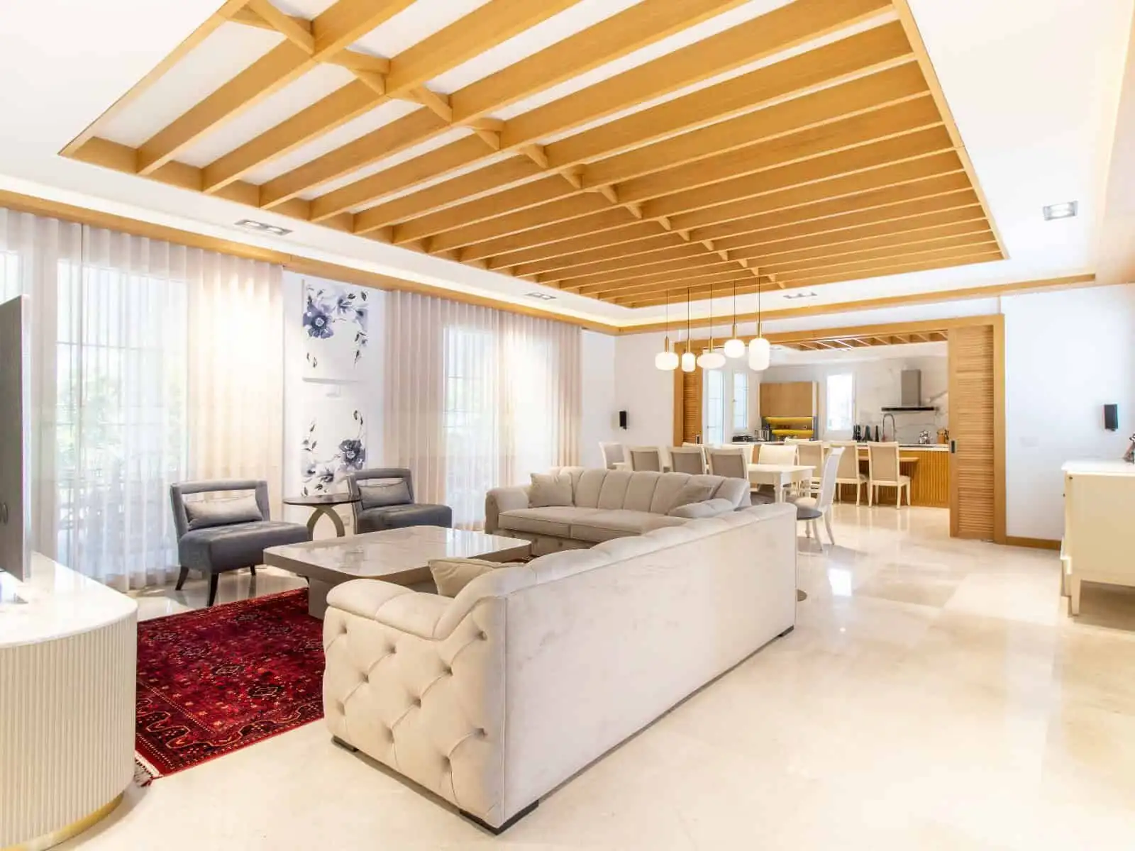 Spacious living room of a luxury 4-bedroom villa in Kyrenia North, featuring modern decor and open-p.