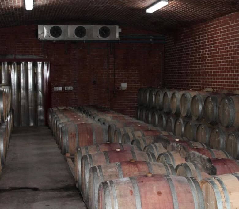 Wine barrel storage room at Mont du Toit Wine & Olive Estate in Wellington, Western Cape.