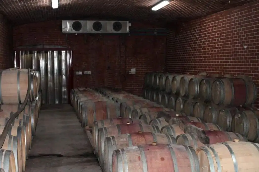 Wine barrel storage room at Mont du Toit Wine & Olive Estate in Wellington, Western Cape.