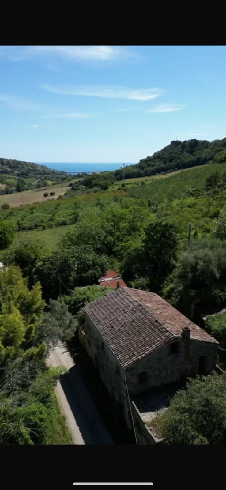 Charming Farmhouse with Sea View Rustic farmhouse surrounded by lush greenery with distant sea view in Campofilone, Fermo.