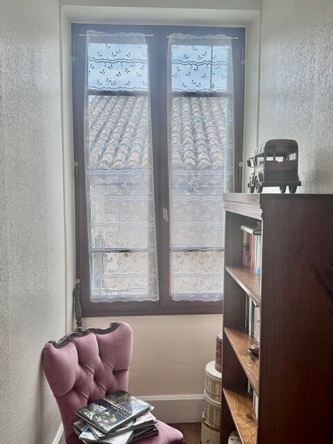 Balcony with decorative glass doors in a charming French home.