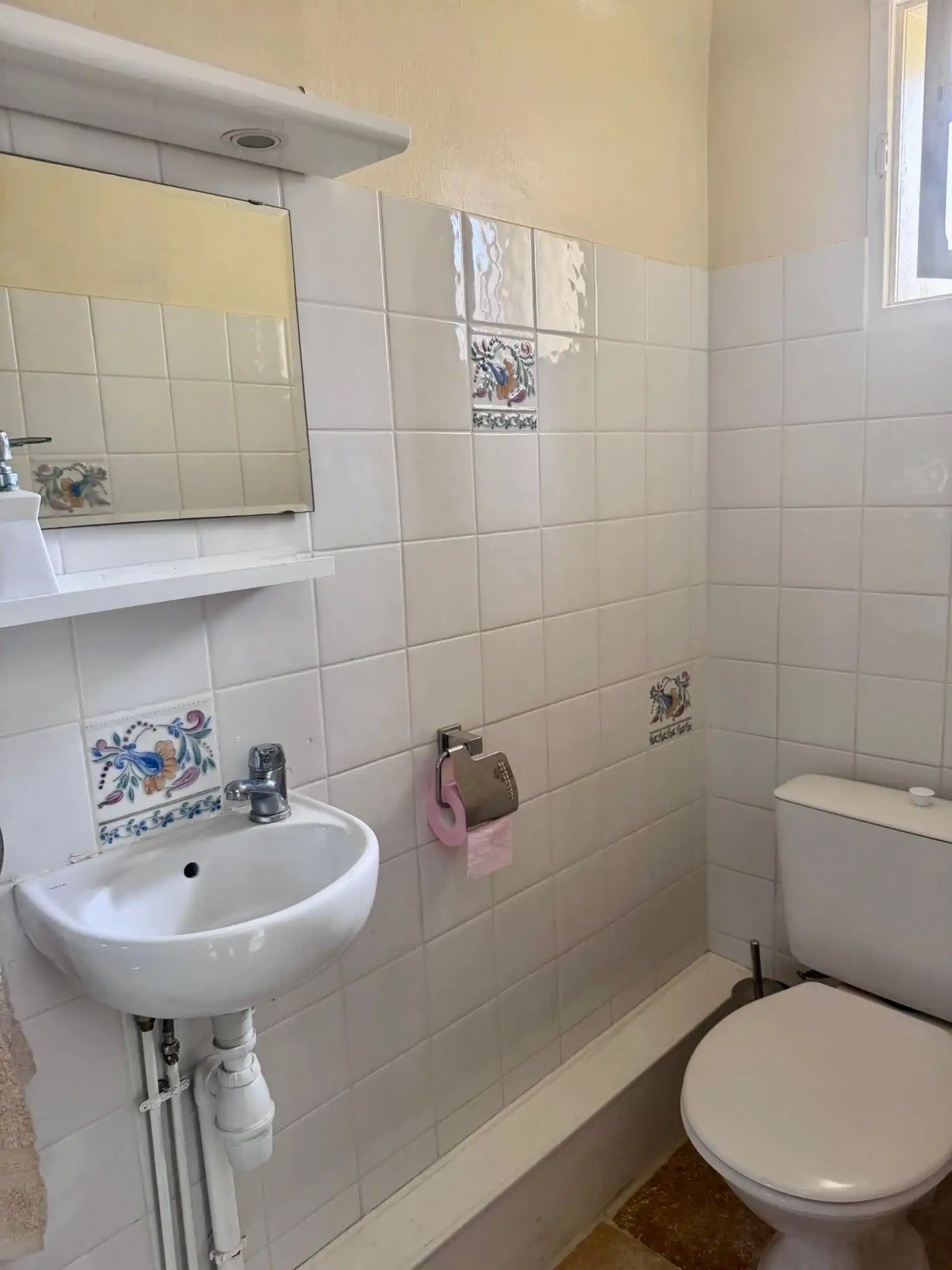 Charming bathroom with small sink and toilet in a modern townhouse. Perfect for comfortable living i.