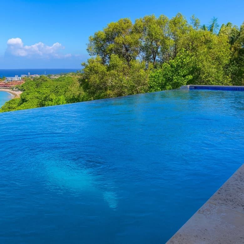 Luxury pool with ocean view at Sosua estate, Dominican Republic.