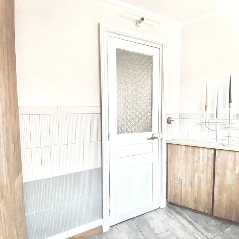 Bright interior door in a stylish apartment in Paris.