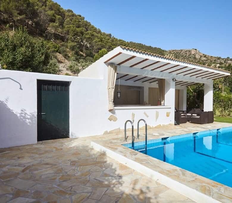 Beautiful outdoor pool area at a luxurious 7-bedroom estate in La Cerradura, Jaen.