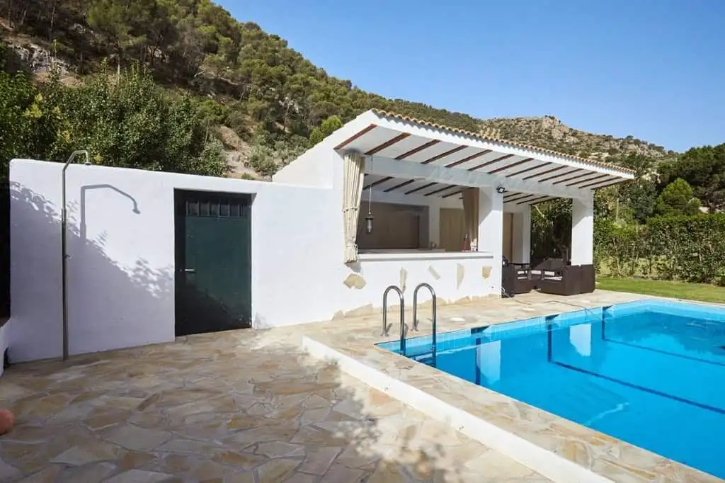 Beautiful outdoor pool area at a luxurious 7-bedroom estate in La Cerradura, Jaen.
