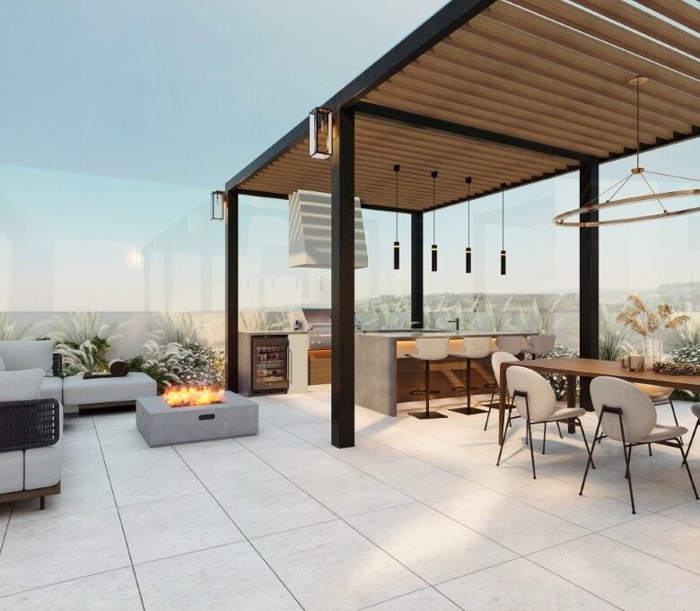 Modern rooftop terrace of luxury condos in Tijuana with seating and fire pit.
