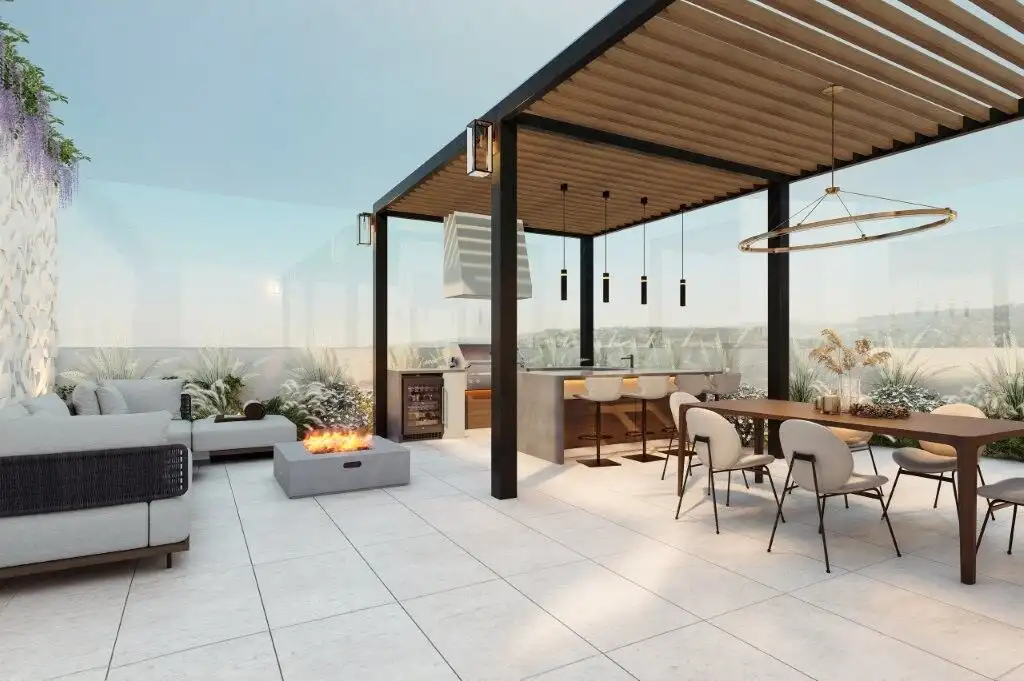 Modern rooftop terrace of luxury condos in Tijuana with seating and fire pit.