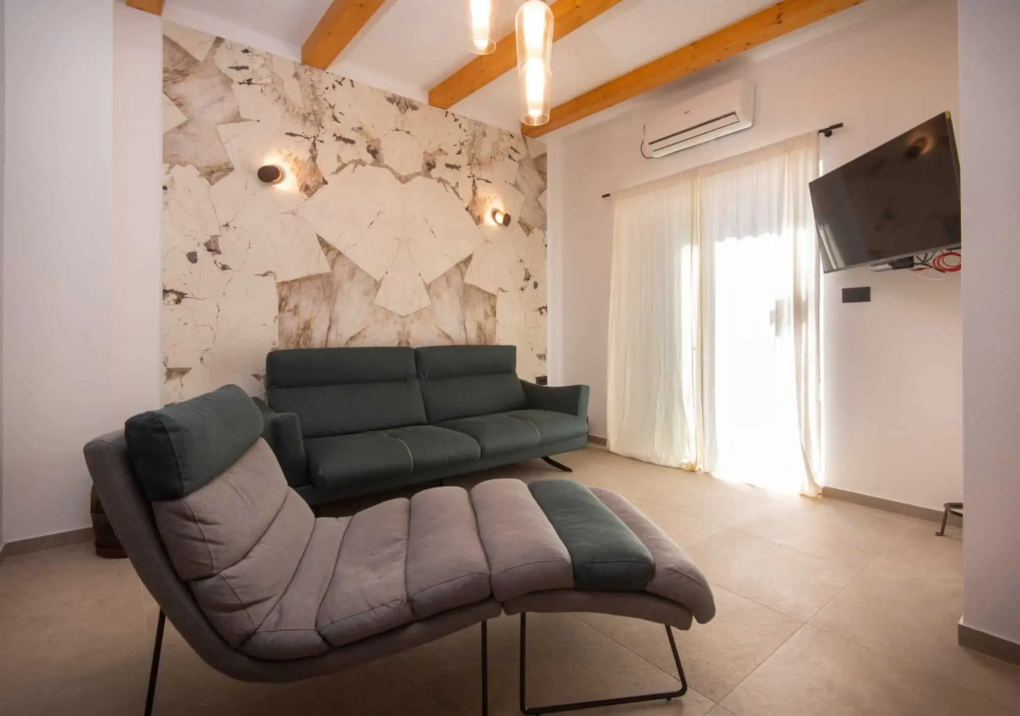 Modern living room with stylish furniture in a high-end Split home. Modern living room with stylish furniture in a high-end Split home.