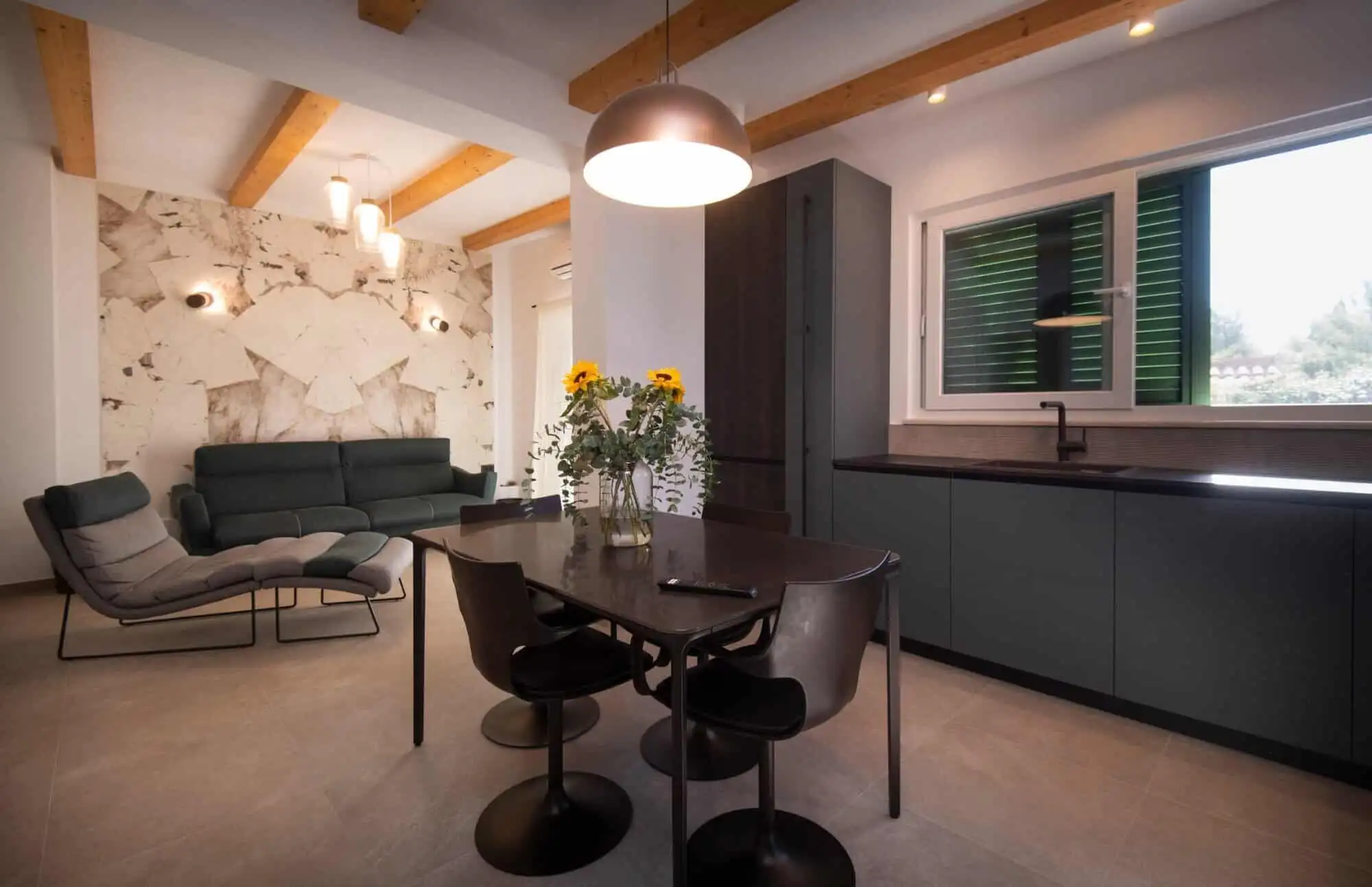 Modern Split single-storey home interior with open-plan living and kitchen area. Modern Split single-storey house interior with open-plan living and kitchen space.