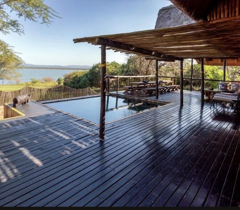 Swaziland game lodge with pool, deck, and scenic lake views for sale.