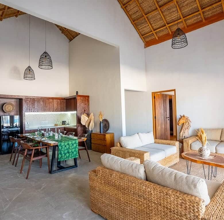 Elegant living space with natural materials and modern design in Sumba beachfront villas.