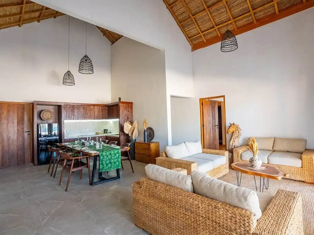 Elegant living space with natural materials and modern design in Sumba beachfront villas.